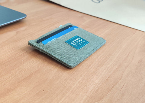 Green skinny hemp wallet on a table